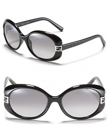 Retro-inspired round frame sunglasses with signature Fendi logo detail at temples. Retro-inspired round frame sunglasses with signature Fendi logo detail at temples.