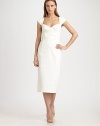 This ultra-feminine dress features a unique cross-over belt, fastened in back with a bright grosgrain bow.Sweetheart necklineCap sleevesCross-over wrap belt with contrast back tiesBack slitConcealed back zipFully linedAbout 29 from natural waist56% cotton/38% polyester/6% spandexDry cleanMade in USA of imported fabricModel shown is 5'9½ (176cm) wearing US size 4. 