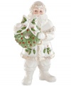 Santa's got it all. Radiating grace in glazed porcelain, this collectible figurine carries a simple wreath and, adorned with a quaint holly pattern, coordinates beautifully with classic Holiday decor by Lenox.