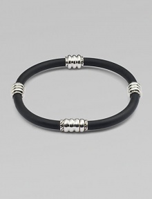 Modern simplicity in a single rubber cord with sterling silver stations.RubberSilverAbout 3 diameterSlip-on styleImported Modern simplicity in a single rubber cord with sterling silver stations.RubberSilverAbout 3 diameterSlip-on styleImported