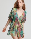 Take your love of prints poolside with this printed tunic from PilyQ. With delicate smocking and floaty sleeves, this cover up lends a bohemian vibe to your sunbathing routine.