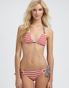 A striped delight with grommet details that connect the unique halter strap ties to triangle cups.Halter strap ties at neckRemovable soft cupsBack tie closure82% nylon/18% spandexFully linedHand washImported Please note: Bikini bottom sold separately. 