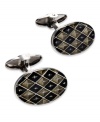 The perfect accent for the modern-day business man. These sleek oval-shaped cuff links feature rounded ends and a unique checkered design. Set in sterling silver with black and grey enamel overlay. Approximate length: 13/16 inch. Approximate width: 1/2 inch.