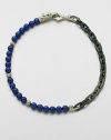 A brilliant strand of smooth lapis beads joins together with intricate links of sterling silver and stainless steel, and is finished with a sculpted sterling silver clasp.LapisSterling silver/stainless steelAbout 3 diam.Imported