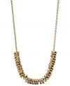 Go for the gold tones. Fossil's necklace, crafted from gold-tone mixed metal, dazzles with sparkling black accents for a shining statement. Approximate length: 16 inches + 2-inch extender.