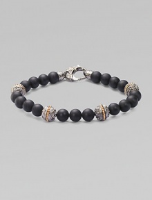 A bold statement in sterling silver and matte onyx with handsome engraved detail. Sterling silver Onyx 8mm beads About 9 long Imported A bold statement in sterling silver and matte onyx with handsome engraved detail. Sterling silver Onyx 8mm beads About 9 long Imported