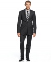 In a sophisticated charcoal plaid and modern slim fit, this Calvin Klein suit was built to last.