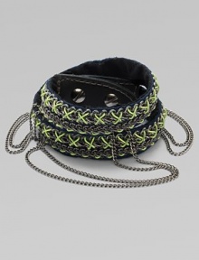 An edgy, street-smart design with oxidized links brightly stitched onto a double-wrap leather cuff with draped chains and a bold stud closure.LeatherGoldtoneCotton backingLength, about 16½Width, about 3Stud snap closureImported An edgy, street-smart design with oxidized links brightly stitched onto a double-wrap leather cuff with draped chains and a bold stud closure.LeatherGoldtoneCotton backingLength, about 16½Width, about 3Stud snap closureImported