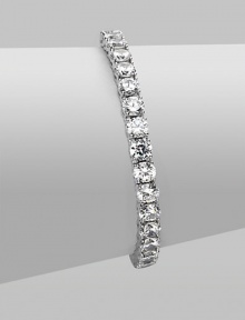 EXCLUSIVELY AT SAKS. Clear cubic zirconia stones in a classic tennis bracelet design.Cubic zirconia Rhodium plated sterling silver Length, about 7 Push lock closure Imported 