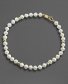 Everyday elegance, fit for any age. This lovely simulated pearl bracelet is accented with 14k gold beads.