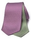 A delicate geometric pattern in luxurious silk adorns this handsome tie from Salvatore Ferragamo.