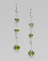 From the Silver Rain Collection. Delicate diamonds and richly colored faceted peridot within setttings of hammered sterling silver dangle delightfully from graceful chains.Diamonds, .20 tcw PeridotSterling silverDrop, about 2½Ear wireImported