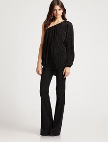 Pleated poly-knit in a disco-inspired one-shoulder silhouette.Elastic at necklineDropped shoulderSingle gathered sleeveAsymmetrical hemPolyesterDry cleanMade in USA of imported fabricModel shown is 5'10 (177cm) wearing US size small. Pleated poly-knit in a disco-inspired one-shoulder silhouette.Elastic at necklineDropped shoulderSingle gathered sleeveAsymmetrical hemPolyesterDry cleanMade in USA of imported fabricModel shown is 5'10 (177cm) wearing US size small.