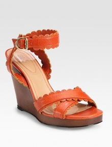 A chic snake-embossed leather style with scalloped trim, stacked wedge heel and sturdy wrap-around ankle strap. Stacked wedge, 4 (100mm)Stacked platform, ¾ (20mm)Compares to a 3¼ heel (80mm)Snake-embossed leather upperAdjustable ankle strapLeather lining and solePadded insoleImportedOUR FIT MODEL RECOMMENDS ordering one size up as this style runs small. A chic snake-embossed leather style with scalloped trim, stacked wedge heel and sturdy wrap-around ankle strap. Stacked wedge, 4 (100mm)Stacked platform, ¾ (20mm)Compares to a 3¼ heel (80mm)Snake-embossed leather upperAdjustable ankle strapLeather lining and solePadded insoleImportedOUR FIT MODEL RECOMMENDS ordering one size up as this style runs small.