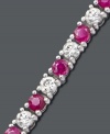 A classic tennis bracelet with an extra hint of vibrance. Sparkling round-cut white sapphires (2-3/4 ct. t.w.) and rubies (2-1/2 ct. t.w.) combine in a polished sterling silver setting. Approximate length: 7 inches.