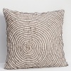Fashioned with ruffled frills, the pattern on this sham is reminiscent of tree rings.