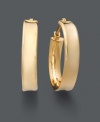 Stylish, yet timeless. Luminous gold hoop earrings are a staple for every woman's wardrobe. Crafted in 14k gold with unique ribbed design. Approximate diameter: 3/4 inch.
