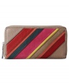 Mod stripes lend a vintage vibe to this cool clutch from Fossil, featuring pretty patchwork of rich leather and smooth suede. Ideally sized to slip inside a handbag, it boasts plenty of pockets and compartments to stow your stash.