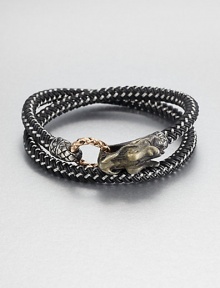 From the Naga Collection. A bold, braided strand of black nylon cord wraps the wrist twice, then clasps with a woven bronze ring and a Naga dragon hook of sterling silver.NylonSterling silver and bronzeStrap width, about .25Diameter, about 2.5Hook-and-ring closureMade in Bali