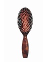 The Classic Brush leaves the hair shiny and static-free, its natural boar bristles protect the hair and stimulate the scalp. The Classic Brush is handcrafted in France from faux tortoise and natural boar bristles.