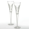 These special flutes say this pair belongs together. Representing the traditional gift giving of anniversaries, these beautiful flutes are adorned with celebratory bows. Your Waterford Crystal anniversary flutes celebrates both your past and your future, toasting to years shared together. Set of 2; 5 oz.