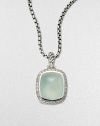 From the Noblesse Collection. A beautiful center stone of aqua chalcedony surrounded by a row of brilliant diamonds on a sterling silver box link chain. Aqua chalcedonyDiamonds, .3 tcwSterling silverLength, about 17Pendant size, about ½Lobster clasp closureImported 