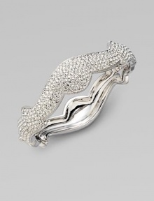 A beautifully curvy design in plated rhodium. Brass Hinged, box and tongue closure Diameter, about 2¼ Width, about ½ Imported A beautifully curvy design in plated rhodium. Brass Hinged, box and tongue closure Diameter, about 2¼ Width, about ½ Imported