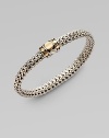 From the Dot Collection. An elegant, flexible braid of sterling silver, with an 18k gold-accented dot design clasp.Sterling silver 18k yellow gold Length, about 7¼ Push-lock clasp Made in Bali