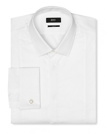 Slim fit tuxedo dress shirt with intricate pintuck detail in front. Covered placket except top button showing, tonal textured stripes. Small point collar. French cuffs.