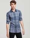 Soft blue hues make a subtle statement on the check-printed Burberry Treyforth shirt.