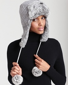 A cute and cozy knit aviator hat that features dyed fur ears, pom-pon ties and a flip-up brim. A cute and cozy knit aviator hat that features dyed fur ears, pom-pon ties and a flip-up brim.