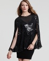 Achieve traffic-stopping glam in this DKNY sequin cape blouse, styled in a flowing silhouette so you're draped in dazzle.