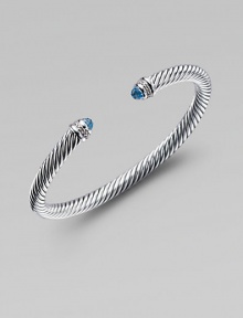 From the Color Classic Collection. A signature Yurman cable of sterling silver, richly enhanced by bands of pavé diamonds encircling blue topaz end caps. Diamonds, .09 tcw Blue topaz Sterling silver Width, 5mm Diameter, about 2½ Made in USA From the Color Classic Collection. A signature Yurman cable of sterling silver, richly enhanced by bands of pavé diamonds encircling blue topaz end caps. Diamonds, .09 tcw Blue topaz Sterling silver Width, 5mm Diameter, about 2½ Made in USA
