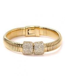 Introduce slinky chic into your jewel box with MICHAEL Michael Kors' crystal-encrusted bangle. Worn solo, this serpentine cuff makes a major impact. Introduce slinky chic into your jewel box with MICHAEL Michael Kors' crystal-encrusted bangle. Worn solo, this serpentine cuff makes a major impact.