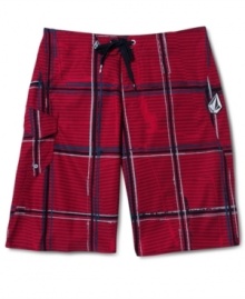 Hit the sand and surf in style with these plaid board shorts by Volcom. Hit the sand and surf in style with these plaid board shorts by Volcom.