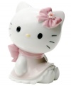 Wearing a pretty pink bow and scalloped dress, Hello Kitty is the essence of cute in this soon-to-be-cherished porcelain figurine from Nao by Lladro.