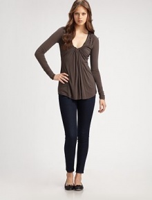 Soft jersey drapes beautifully over the body in a gathered scoopneck silhouette.Scoopneck Long sleeves Gathered bodice Shirttail hem About 28 from shoulder to hem Self: 94% rayon/6% spandex/trim: cotton Dry clean Made in USA of imported fabric Soft jersey drapes beautifully over the body in a gathered scoopneck silhouette.Scoopneck Long sleeves Gathered bodice Shirttail hem About 28 from shoulder to hem Self: 94% rayon/6% spandex/trim: cotton Dry clean Made in USA of imported fabric