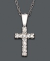 Delicate and shimmering, this diamond-accented cross pendant is perfect for your little darling. Necklace set in 14k white gold. Approximate length: 15 inches. Approximate drop: 1/2 inch.
