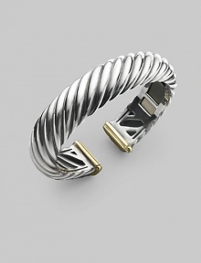 From the Carved Cable Collection. A bold cable cuff of sterling silver, richly accented with touches of 18k gold. Sterling silver and 18k yellow gold Cable, 15mm Diameter, about 2¼ Hinged Imported From the Carved Cable Collection. A bold cable cuff of sterling silver, richly accented with touches of 18k gold. Sterling silver and 18k yellow gold Cable, 15mm Diameter, about 2¼ Hinged Imported