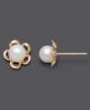 The perfect pair for your little flower child. These children's earrings feature cultured freshwater pearl (5-6 mm) studs with a  cut-out flower design. Set in 14k gold. Approximate diameter: 1/3 inch.