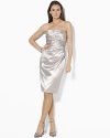 Lustrous satin in an elegant strapless silhouette is softly gathered along the side for a subtle draped effect.