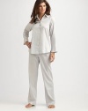 Experience the ultimate in luxury with this smooth cotton sateen two-piece set in a timeless silhouette. Shirt collarLong sleevesButton front closureBack pleatingHigh-low hemElastic waistbandInseam, about 32Laundered cotton sateenMachine washImported