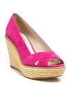 A vacation-perfect wedge from KORS Michael Kors, rendered in shocking pink suede.