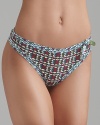 A printed thong with contrast printed trim and large bow accent at side, a playful style from Princesse Tam Tam.