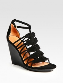 Suede gladiator-inspired straps make their way up the front of the foot, concluding with an adjustable ankle strap. Self-covered wedge, 4 (100mm)Covered platform, ½ (15mm)Compares to a 3½ heel (90mm)Suede upperLeather lining and solePadded insoleMade in Francebr>OUR FIT MODEL RECOMMENDS ordering one half size up as this style runs small. Suede gladiator-inspired straps make their way up the front of the foot, concluding with an adjustable ankle strap. Self-covered wedge, 4 (100mm)Covered platform, ½ (15mm)Compares to a 3½ heel (90mm)Suede upperLeather lining and solePadded insoleMade in Francebr>OUR FIT MODEL RECOMMENDS ordering one half size up as this style runs small.