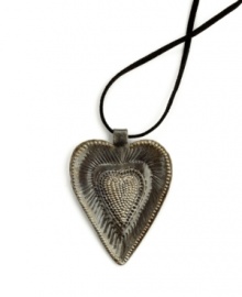 So much to love. The Radiant Heart pendant is full of rich textured detail, hand-cut and hammered in recycled steel by artisans determined to rebuild their lives. After two coats of varnish, each is dried in the hot Caribbean sun. Wear it yourself or give to someone special. So much to love. The Radiant Heart pendant is full of rich textured detail, hand-cut and hammered in recycled steel by artisans determined to rebuild their lives. After two coats of varnish, each is dried in the hot Caribbean sun. Wear it yourself or give to someone special.