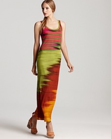 Neon hues electrify this printed Jean Paul Gaultier maxi dress, creating a sizzling look for a sun-soaked getaway. Punctuate this flawless investment piece with bold-hued sandals and strike flawless style by the shore. Neon hues electrify this printed Jean Paul Gaultier maxi dress, creating a sizzling look for a sun-soaked getaway. Punctuate this flawless investment piece with bold-hued sandals and strike flawless style by the shore.
