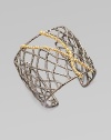 A pretty crystal accented wide cuff with delicate 18k goldplated branches encrusted in pavé Swarovski cystals. Gunmetal-finished brass Length, about 6¼adjustable Width, about 2 Imported 
