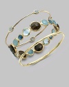 From the Rock Candy® Collection. Five, pretty, milky aquamarine cabochon stations on a delicate 18k gold bangle. Milky aquamarine18K goldSlip-on styleDiameter, about 2½Imported 