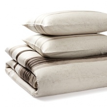 Luxurious combed cotton rendered in a weathered, hand-woven look warms this Calvin Klein duvet set. The duvet and sham are adorned with rough-edged horizontal stripes in sand, gravel, sable and taupe. Luxurious combed cotton rendered in a weathered, hand-woven look warms this Calvin Klein duvet set. The duvet and sham are adorned with rough-edged horizontal stripes in sand, gravel, sable and taupe.